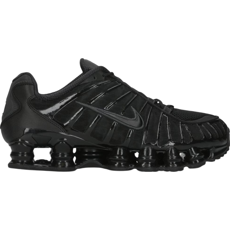 Nike Shox TL sneakers in Black Metallic Hematite — futuristic Nike design with full-length Shox columns and sleek metallic detailing.
